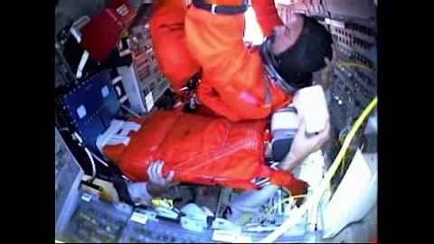 Commander Scott Altman boarding the flight deck of Space Shuttle Atlantis Video stock 283460486