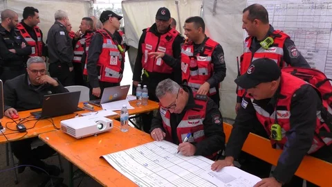 Commanders of the fire brigade get ready for a successful drill Stock Footage 106687959