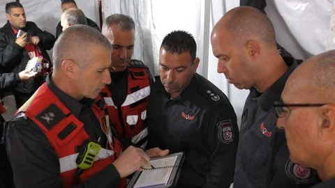 Commanders of the fire brigade get ready for a successful drill Stock Footage 106688803
