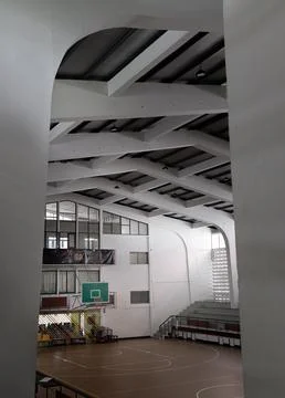 A commanding view framed by sweeping concrete pillars reveals the interior .. Stock Photos