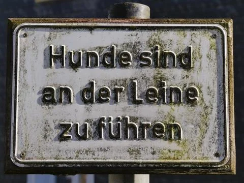 Commandment in German, Dogs are to be kept on a leash. Stock Photos