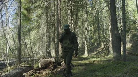 A commando in a mask and with a backpack moves Stock-Footage 195234463