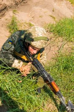 Commando ready to fire from the AK -74 at simulated enemy positions Stock Photos