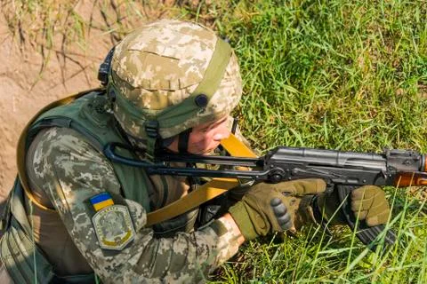 Commando ready to fire from the AK -74 at simulated enemy positions Stock Photos