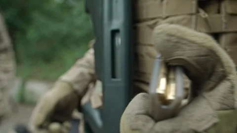 Commandos charged rifle ammunition. Ammunition. Loading ammo. Video stock 108433270