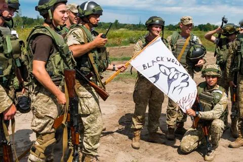 Commandos with white flag after atack at simulated enemy positions Stock Photos