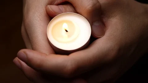 Commemorate background. Candle in hands. Stock Footage 101930338