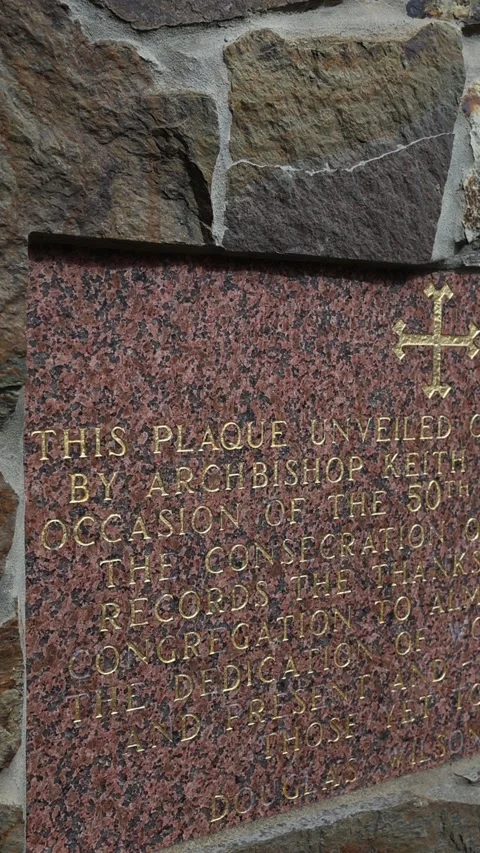 Commemorative granite plaque on a stone wall exterior Stock Footage 341907077