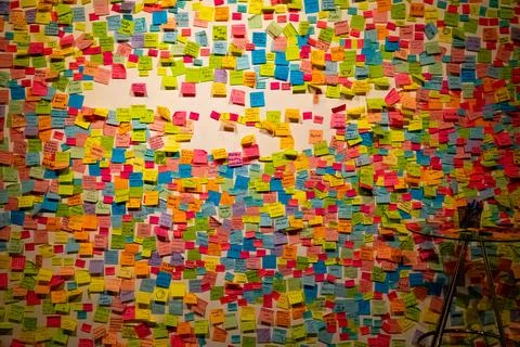 Comment board with multi-colored post-it notes in the exhibition. Stock Photos