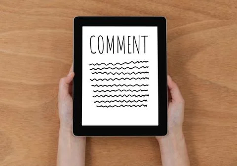 Comment text and graphic on tablet screen with hands Stock Photos