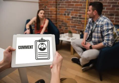 Comment text and graphic on tablet screen with people Stock Photos
