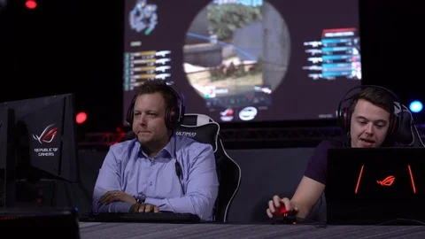 Commentators discussing the game of computer gamers on live. Stock Footage 80389758