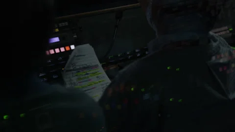 Commenter checks script of swimming competition at darkness Stock Footage 234898329