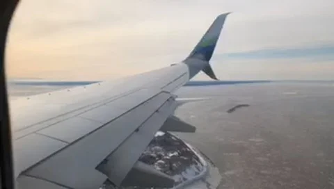 Commercial airline flight over Alaska Stock Footage