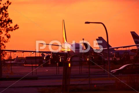 Commercial airliners in sunset. Airport in Sunset Stock Photos