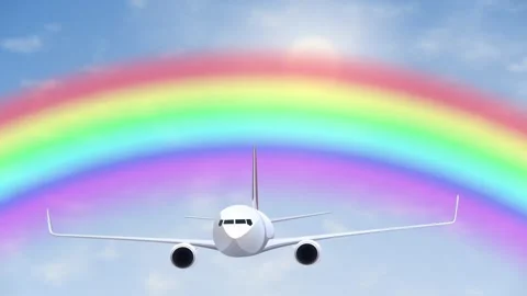 Commercial Airplane Flying Through Blue Sky with Vibrant Rainbow Background Stock Footage 344848814