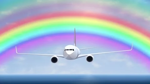 Commercial Airplane Flying Through Sky with Vibrant Rainbow Background Stock Footage 344851083