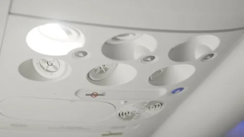 Commercial Airplane Overhead Console Panel with Reading Light Stock Footage 344803731