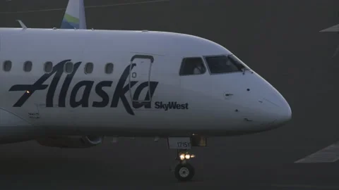 Commercial airplane preparing to take off as seen from a terminal 스톡 동영상 167621182