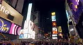 Commercial billboards and crowd on Times Square New York City at night 4k or 4k+ Resolution