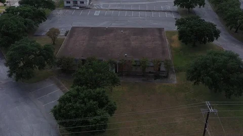 Commercial building behind the trees, Bryan, Texas, USA Stock Footage 129279107