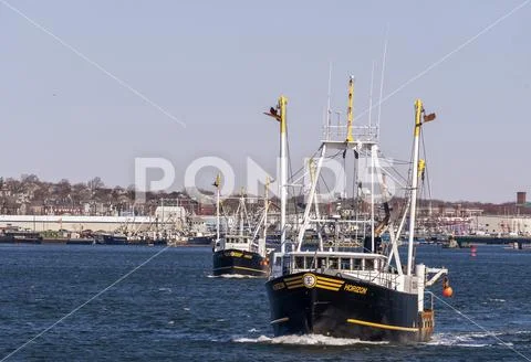 Commercial fishing boats Horizon and Frontier leaving port Stock Photos