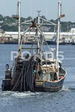 Commercial fishing vessel Enterprise heading up Acushnet River Stock Photos
