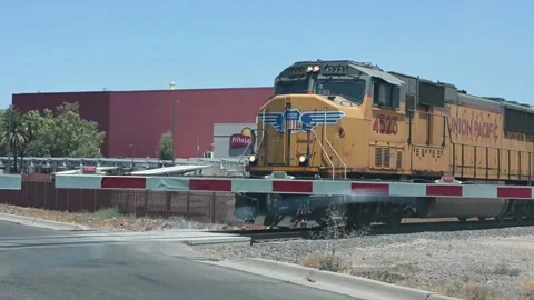 Commercial Freight Train Passing Intersection Stock Footage 134996091