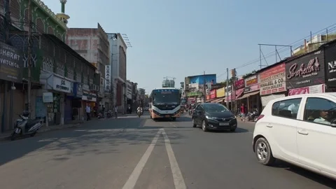 Commercial intersection with retail stores and heavy traffic Stock Footage 336662903