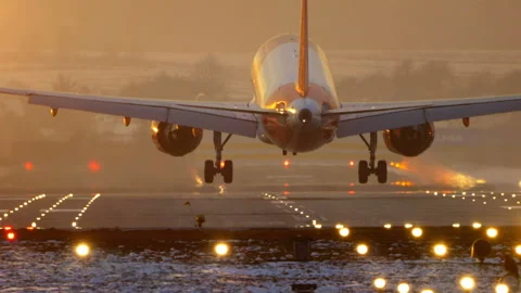 Plane Landing Sunset Stock Footage ~ Royalty Free Stock Videos