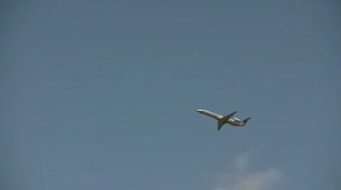 Commercial jet ascends through the cloudy blue sky Stock Footage 360142