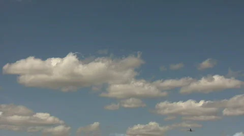 Commercial jet ascends through the cloudy blue sky Stock Footage 360145