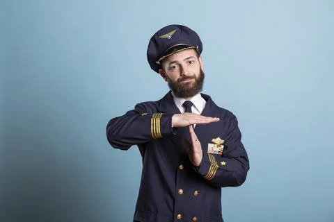 Commercial pilot doing timeout hand gesture, asking for break from work 写真素材