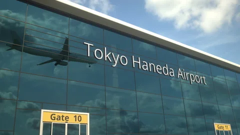Commercial plane landing reflecting in the windows with Tokyo Haneda Airport Stock Footage 154394853