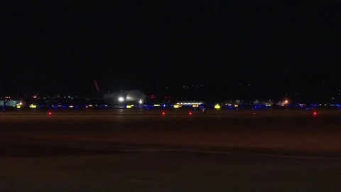Commercial plane taking off at night Stock Footage 87863970