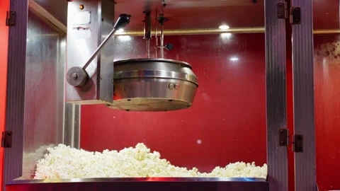 Commercial popcorn machine heating up with steam rising from hot kettle bef.. Stock Footage 338189039