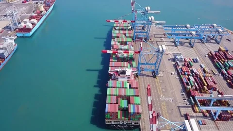 Commercial port with container ships - Top down aerial view. Stock Footage