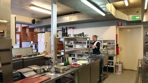 Commercial Restaurant Kitchen Interior with Staff Preparing Dinner Service Stock Footage 343764218