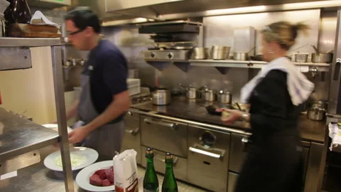 Commercial Restaurant Kitchen Staff Working at Fast Pace During Busy Service Stock Footage 343725042