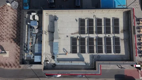 Commercial Rooftop Solar Panel Array Under Inspection, Solar Engineer Assessing Stock Footage 336469379