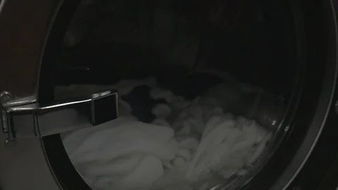 Commercial washing machine in progress, spinning drum, slow motion. Not graded. 動画素材 101773298