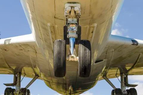 Commerical airplane underneath view Stock Photos