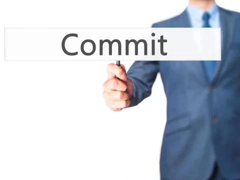 Commit - Business man showing sign Stock Photos