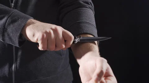 To commit suicide, to cut with a knife. Stock Footage 221652000