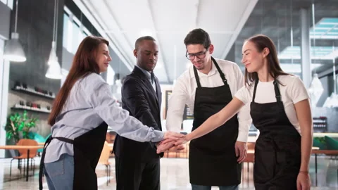 Commited Restaurant Team Stacking Hands Stock Footage 328392885