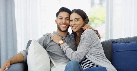 Commitment, love and portrait of couple on sofa of home for bonding, support and Foto stock