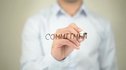Commitment,  Man writing on transparent screen Stockbeeldmateriaal 62982796