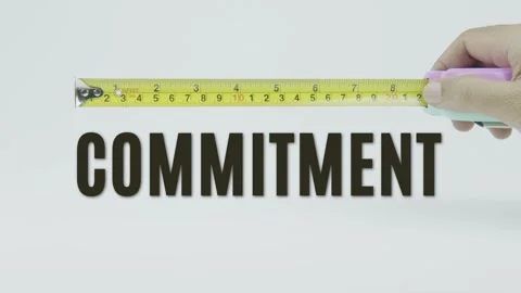 Commitment text or word and tape measure on a white background 動画素材 302048177
