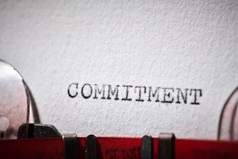 Commitment word text written with a typewriter Stock Photos