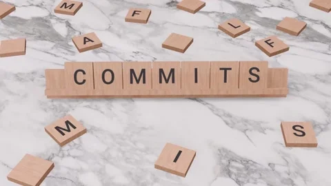 COMMITS word written on scrabble Stock Footage 257396902